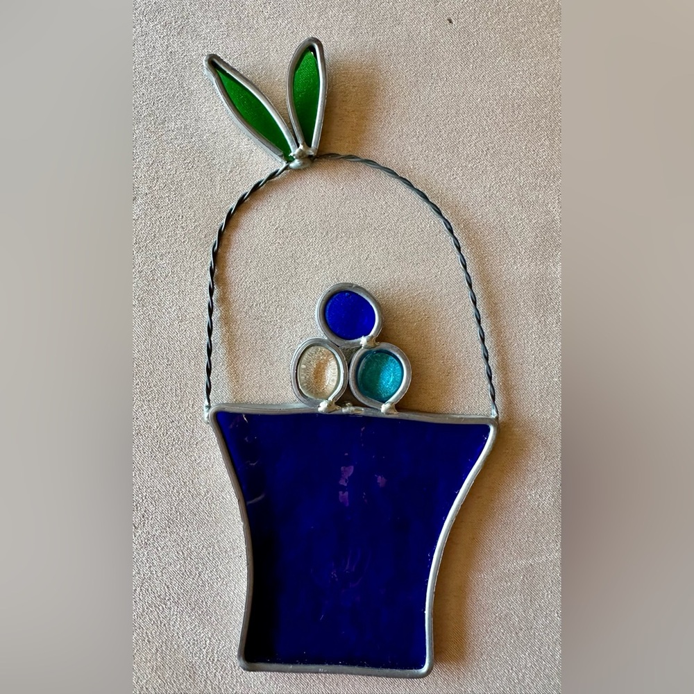 Stained glass sun catcher. Handmade blue basket of eggs. EUC. Easy to hang.